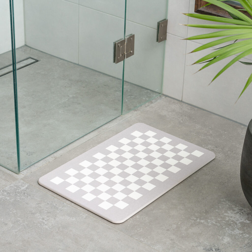 TubTreasures premium stone bath mat placed in front of shower non-slip rubber base