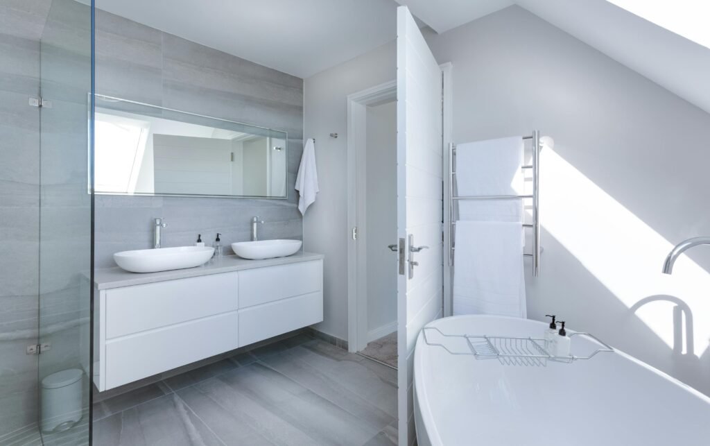 Modern white bathroom, perfect for a sustainable bathroom routine