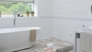 Image showing a modern white bathroom with a big bathtub. A clean bathroom can boost your well-being