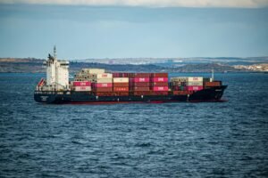 Container ship in the sea impacted by global events